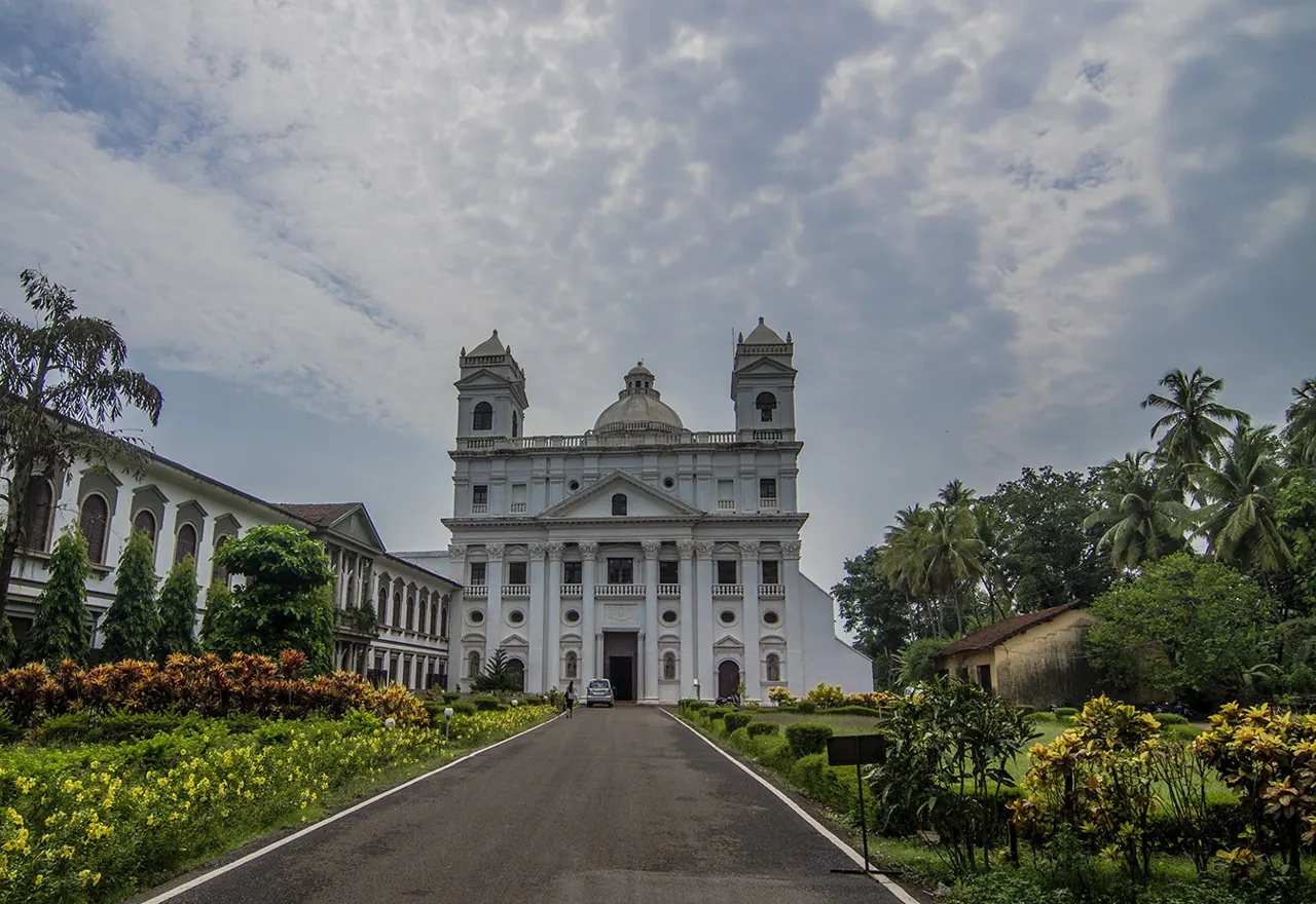 St. Cajetan Church in Old Goa, approached through flowering gardens