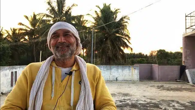 Dr. Ashutosh speaking outdoors