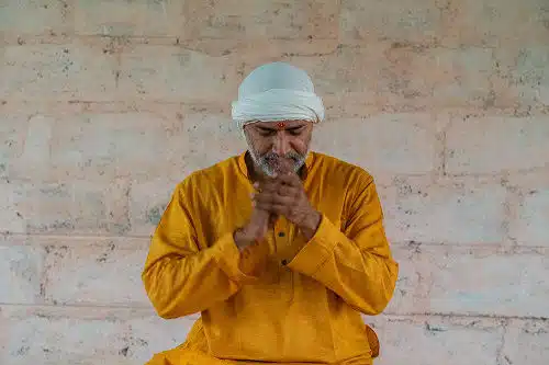 Dr. Ashutosh with hands together in practice